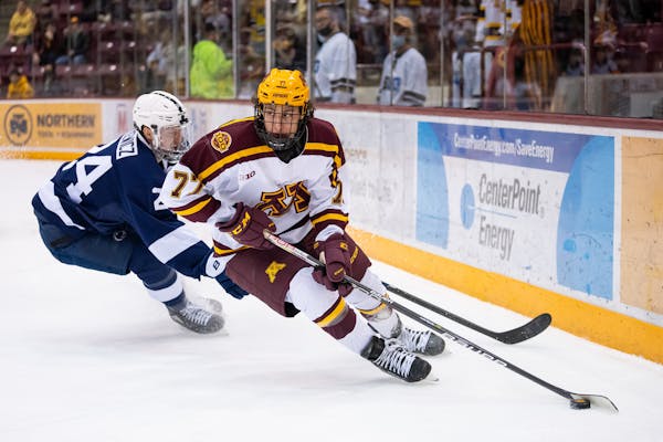 The Gophers’ Rhett Pitlick, above vs. Penn State last season, had two goals as the Gophers beat No. 3 Michigan 5-2 on Thursday night.