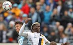 Francisco Calvo(5) of the Loons clashes with Gyasi Zardes(11).