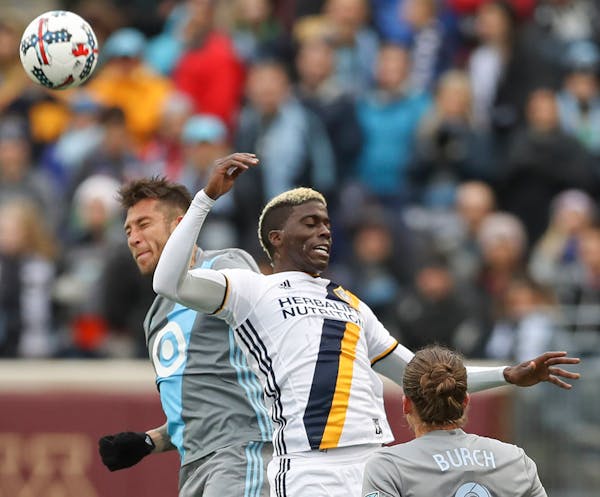 Francisco Calvo(5) of the Loons clashes with Gyasi Zardes(11).