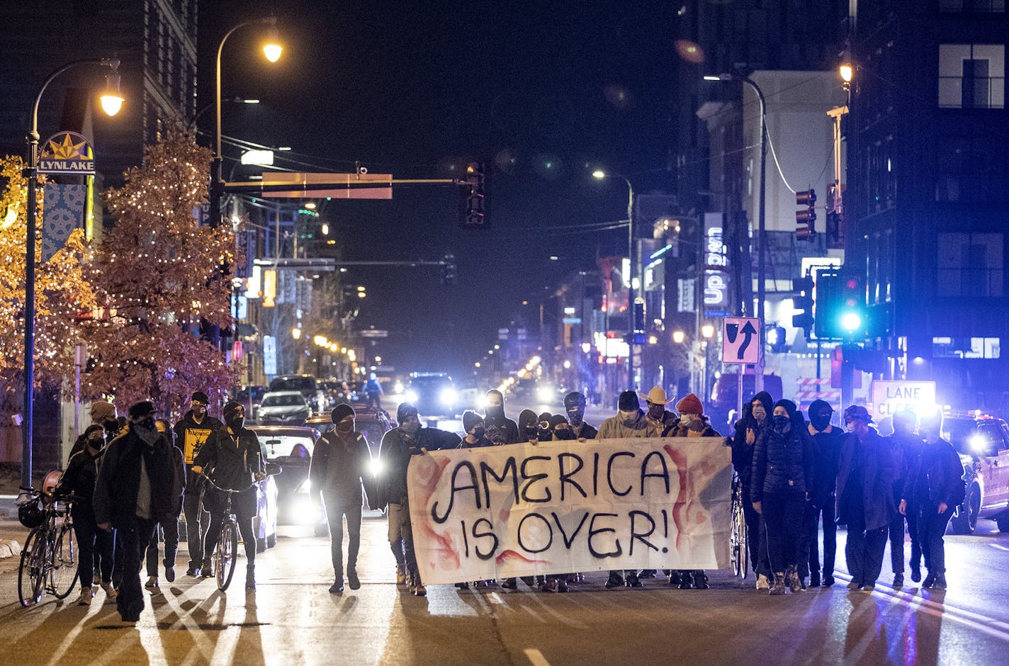 Small group marching on Lake St in the Uptown area a Minneapolis. ] CARLOS GONZALEZ ¥ cgonzalez@startribune.com Ð Minneapolis, MN, November 3, 2020, Election Day