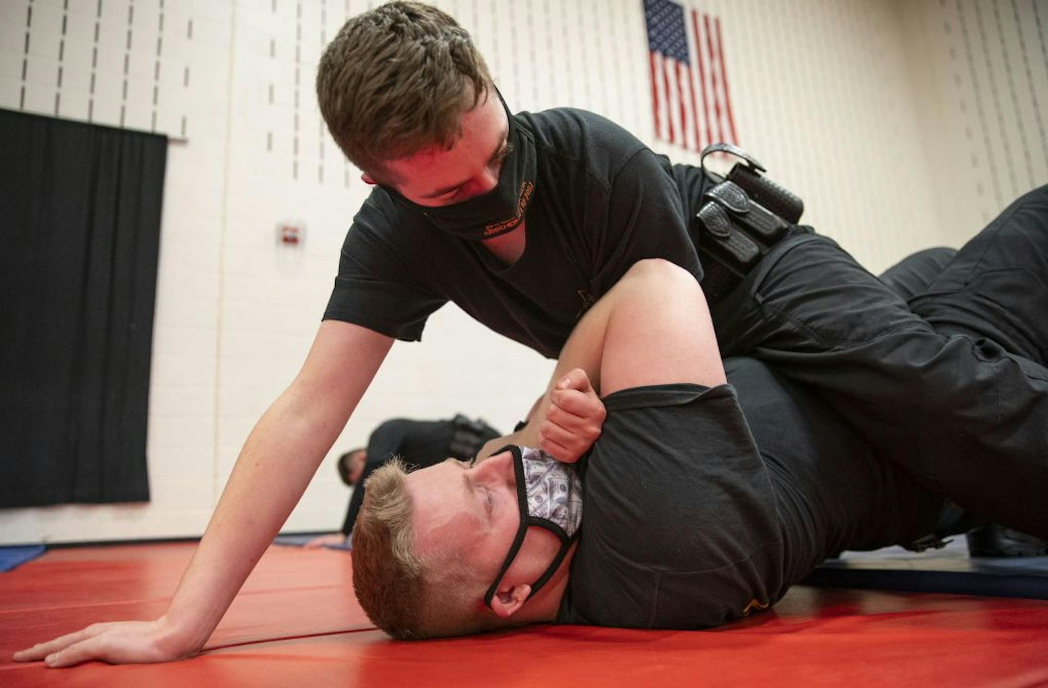 (Top) Collin O'Toole practiced proper ground fighting technique with Joshua Radosevich during defensive tactics class at Fond Du Lac Tribal and Community College in Cloquet, Minn. on Tuesday November 17, 2020.