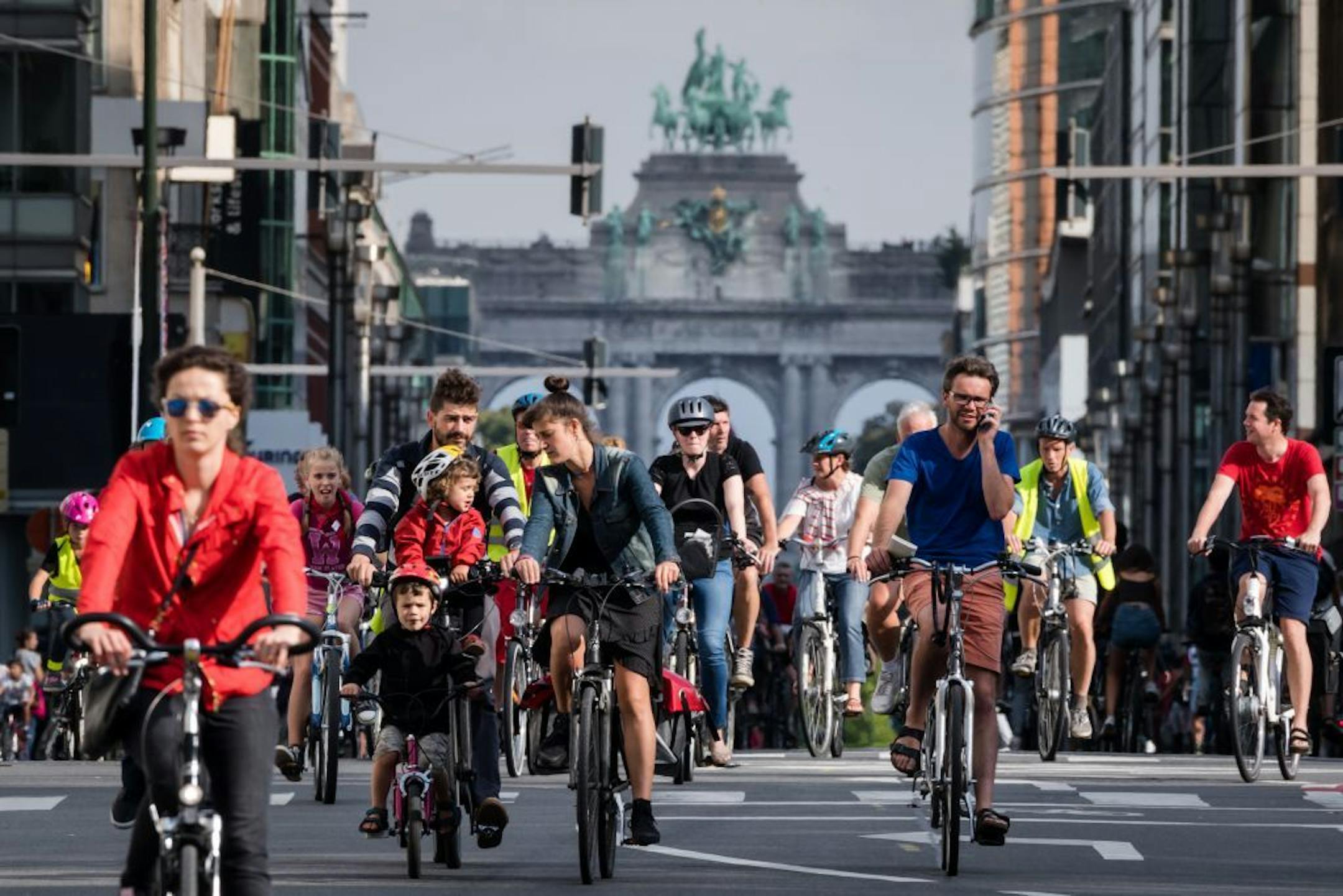 People ride their bicycles on a main boulevard during the yearly car free day in Brussels on Sunday Sept. 18, 2016.
