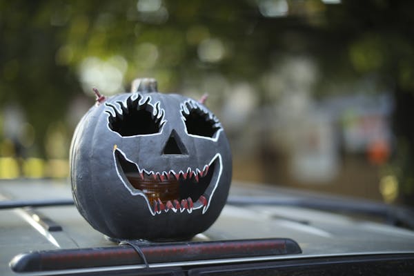 A pumpkin on a vehicle in front of Ed Johnson's house in St. Paul.