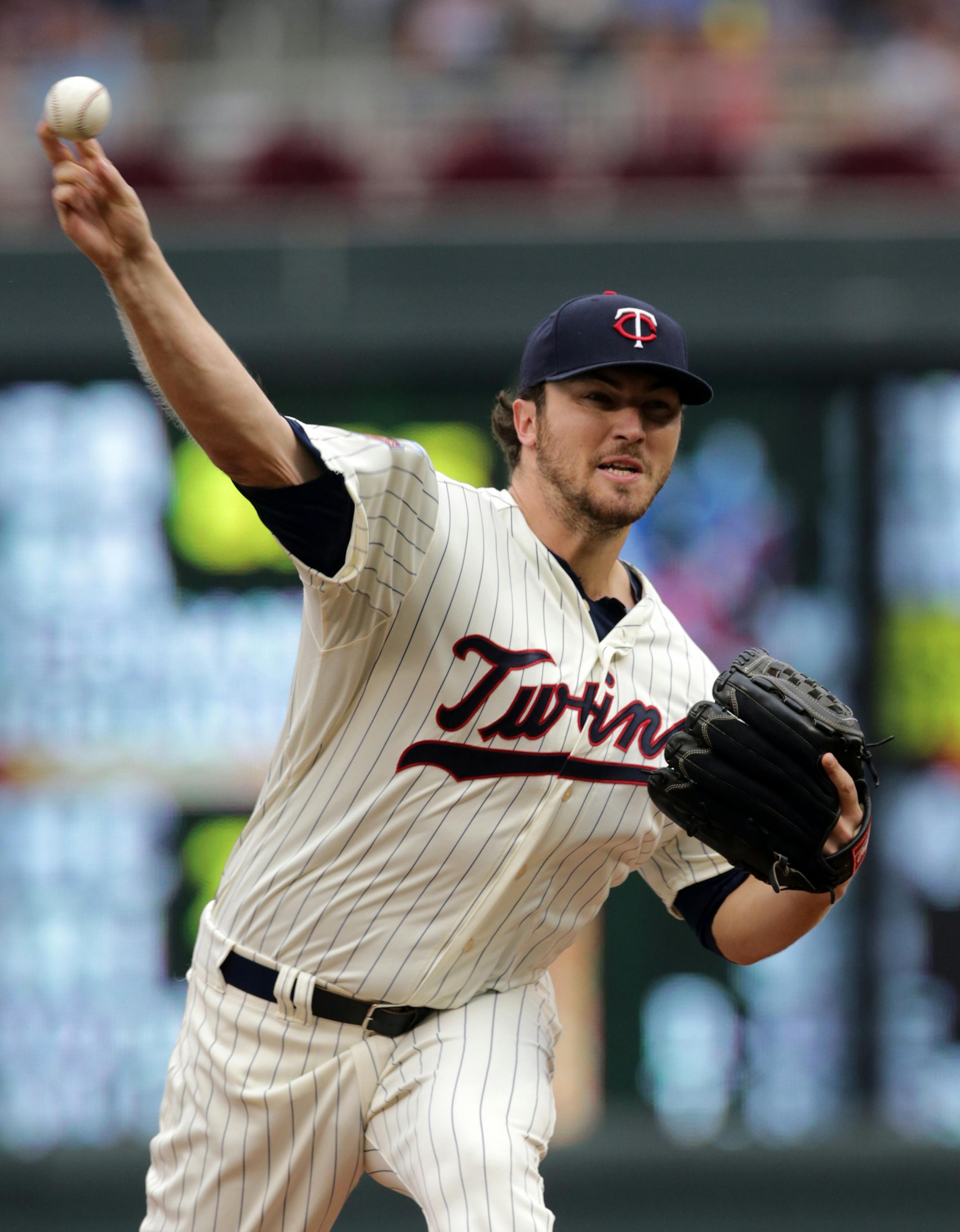 Minnesota Twins pitcher Phil Hughes throws against the Tampa Bay Rays in the first inning of a baseball game, Saturday, July 19, 2014, in Minneapolis. (AP Photo/Jim Mone)