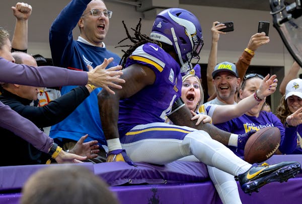 Dalvin Cook celebrated with Vikings fans after his second touchdown of the first half against the Bears on Sunday.