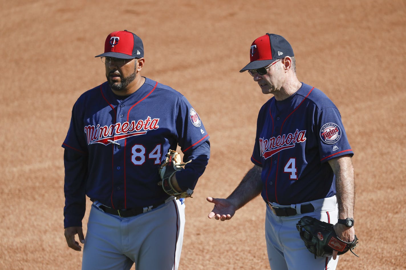 New Twins hitting coach Edgar Varela (left, with former manager Paul Molitor) spent 10 years with the Pirates before joining the Twins' minor league staff.