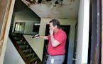 Coon Rapids Chief Building Official Greg Brady braced against the stench of the abandoned house, which will be torn down soon at city expense.