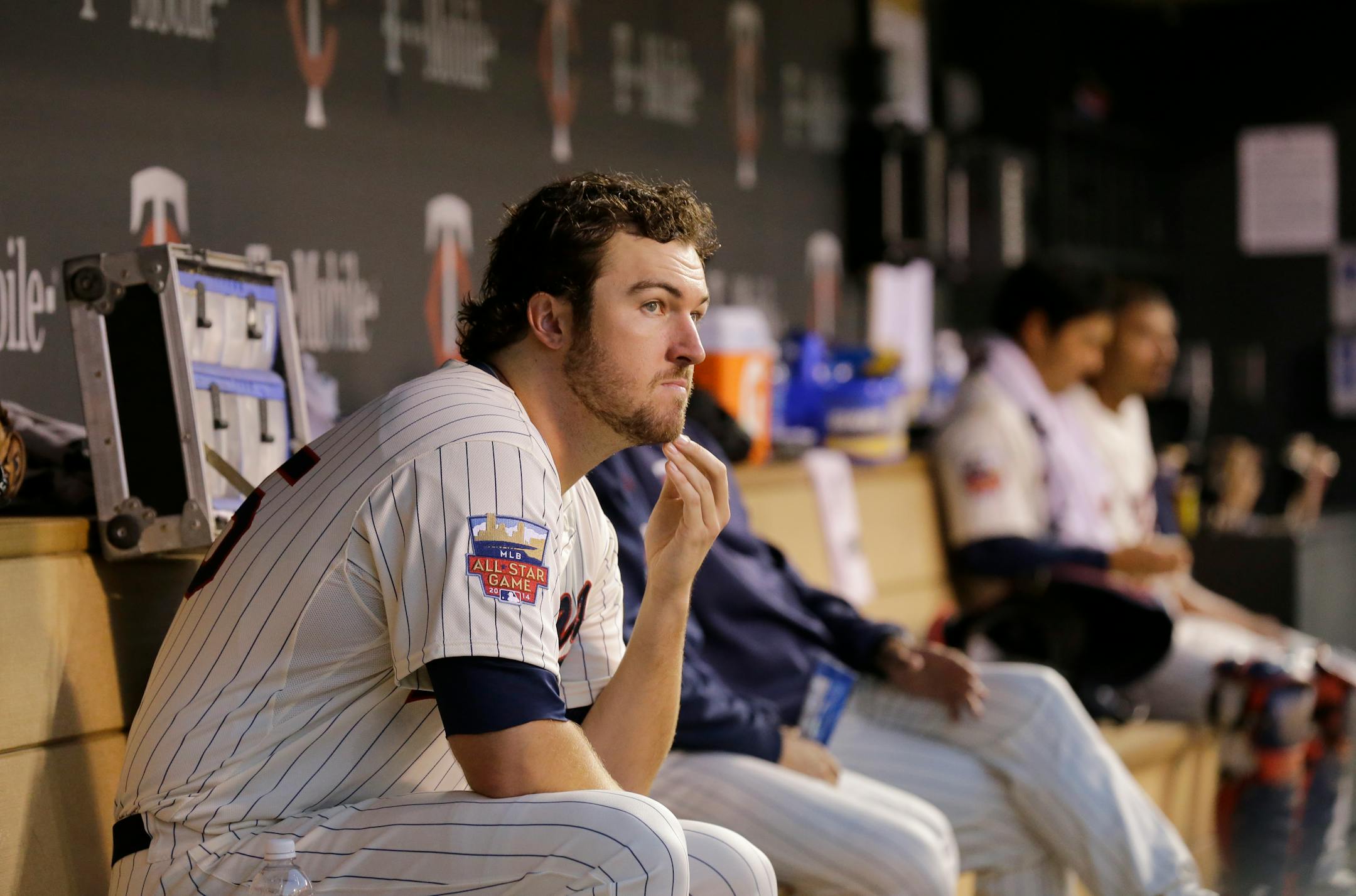 Minnesota Twins pitcher Phil Hughes sits in the dugout during the fourth inning of a baseball game against the Los Angeles Angels in Minneapolis, Saturday, Sept. 6, 2014. (AP Photo/Ann Heisenfelt)