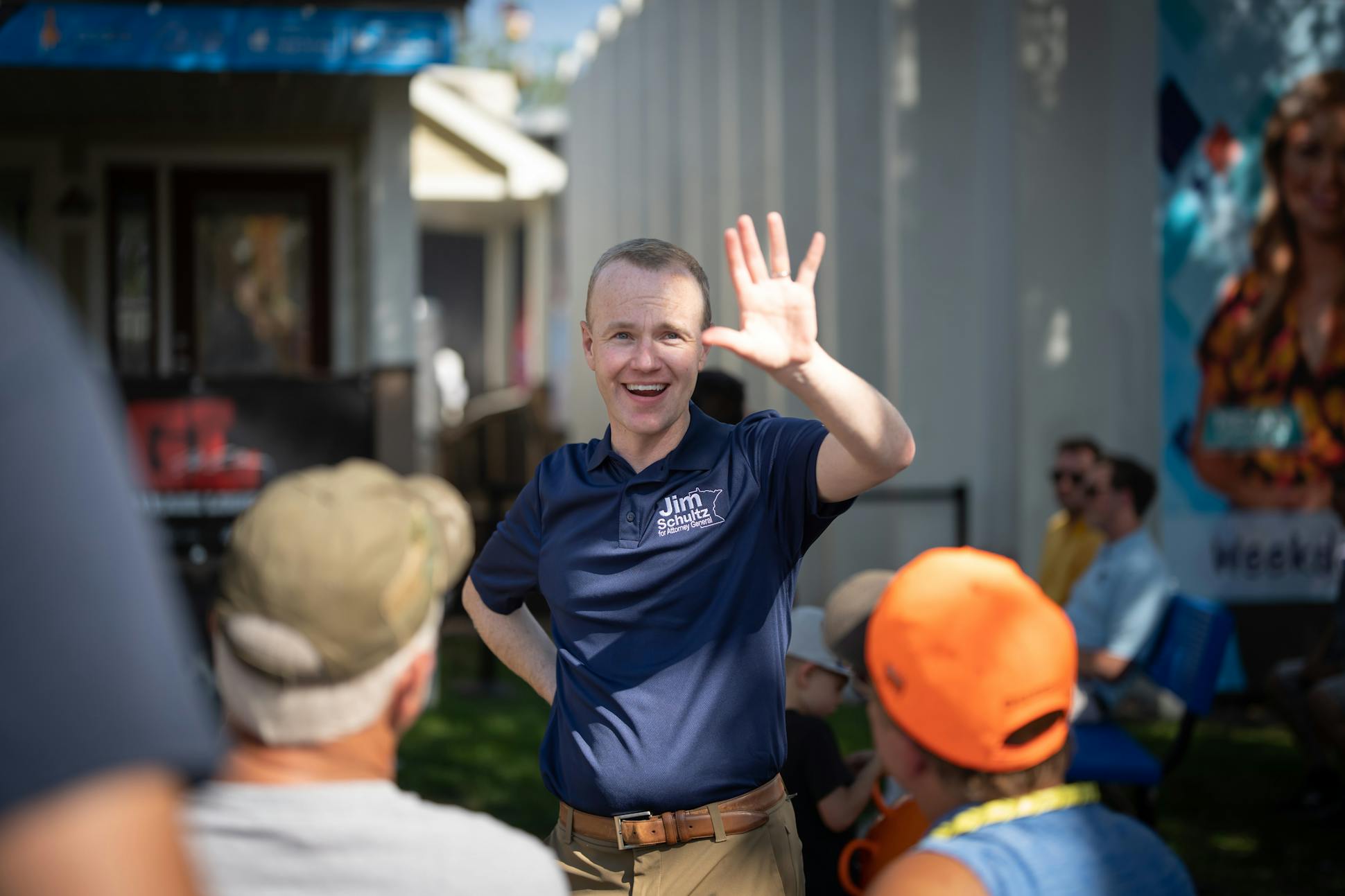 Jim Schultz, Republican candidate for state attorney general, waved as someone called his name while he talked to folks at the State Fair on Aug. 26.