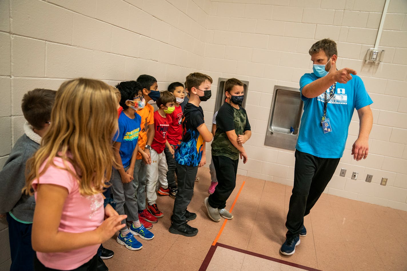 Craig Nilles substitute teaches a physical education class at Woodland Elementary School Tuesday, Oct. 26, 2021 in Eagan, Minn. The substitute teacher shortage continued this fall, with districts reporting more need than ever and hundreds fewer candidates to step up when teachers are ill or need the day off. ] LEILA NAVIDI • leila.navidi@startribune.com