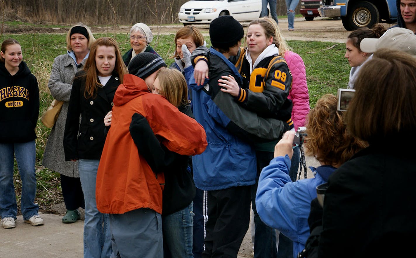 Shawn and Colton said goodbye to their girlfriends before their 70- to 90-day trip. "I kept thinking they'd change their mind," said Sean's mom, Pat, as the boys and their friends gathered on the banks of the Minnesota River in Chaska's Winkel Park Monday morning. "But they never did."