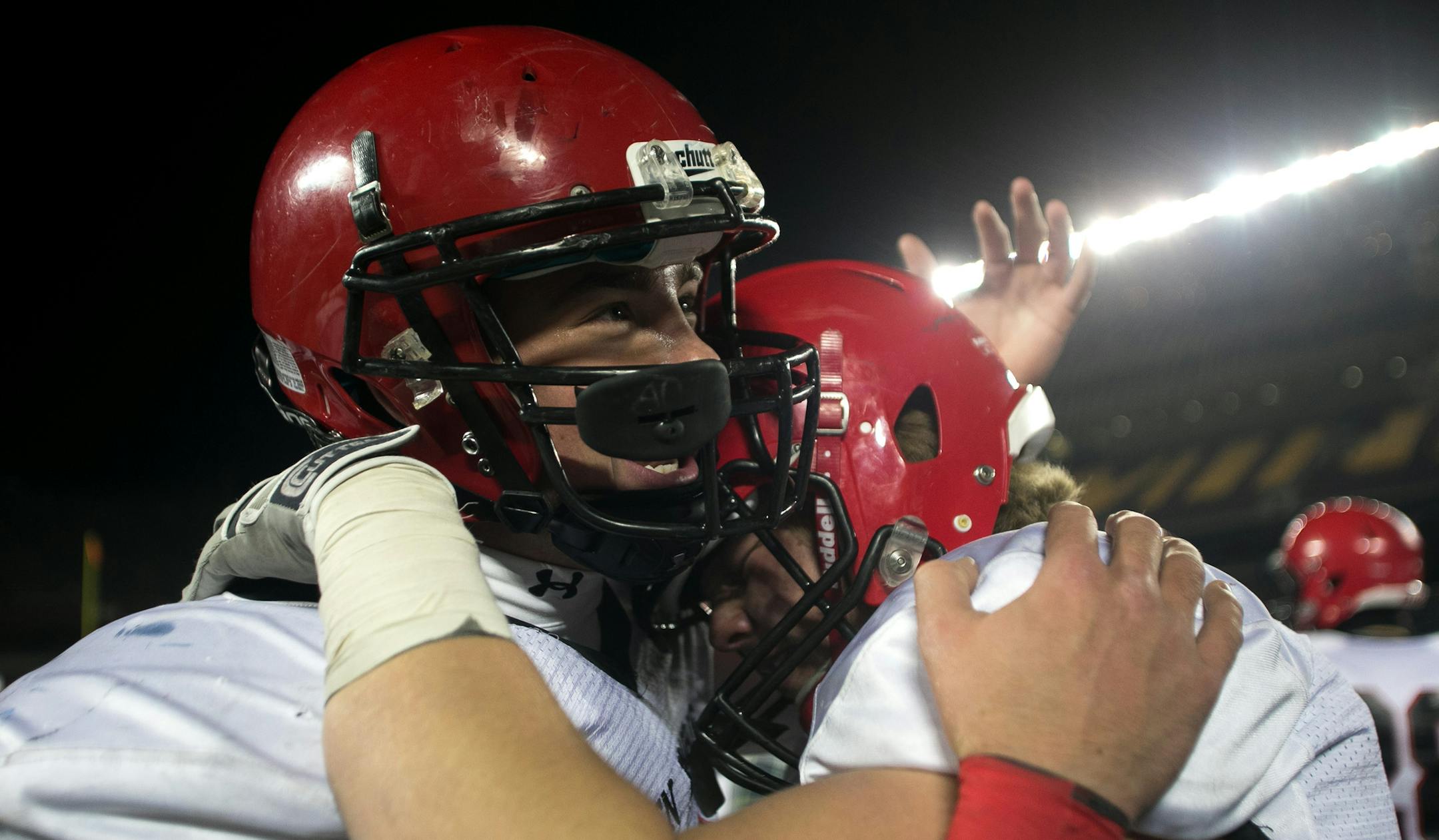 Eden Prairie's Carter Coughlin, left, shares a moment with Joe Fahning after defeating Totino-Grace 29-27 Friday night. ] AARON LAVINSKY • aaron.lavinsky@startribune.com Totino-Grace takes on Eden Prairie in the Class 6A Prep Bowl Friday, Nov. 21, 2014 at TCF Bank Stadium. ORG XMIT: MIN1411212202530036
