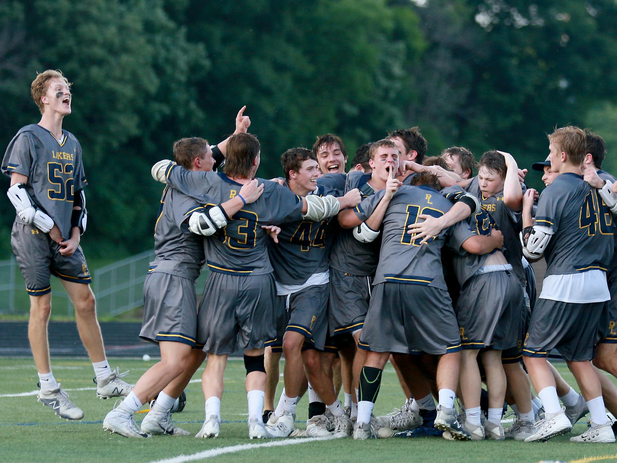 Prior Lake players celebrate after beating Benilde-St. Margaret's 10-8 during the Minnesota State High School League boys' lacrosse championship at Chanhassen High in Chanhassen, MN.] DAVID JOLES ï david.joles@startribune.com Prior Lake and Benilde-St. Margaret's during the first half of the Minnesota State High School League boys' lacrosse championship at Chanhassen High in Chanhassen, MN.