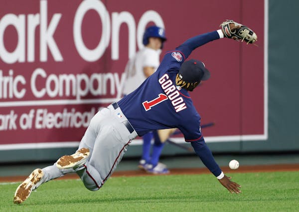 Minnesota Twins shortstop Nick Gordon (1) is unable to catch a short fly ball from Kansas City Royals' Andrew Benintendi during the fourth inning of a