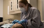Dr. Amber Walker put a filling in Maria Garcia's tooth at Hope Dental Clinic on Thursday, February 8, 2018, in St. Paul, Minn. Hope Dental Clinic, a f