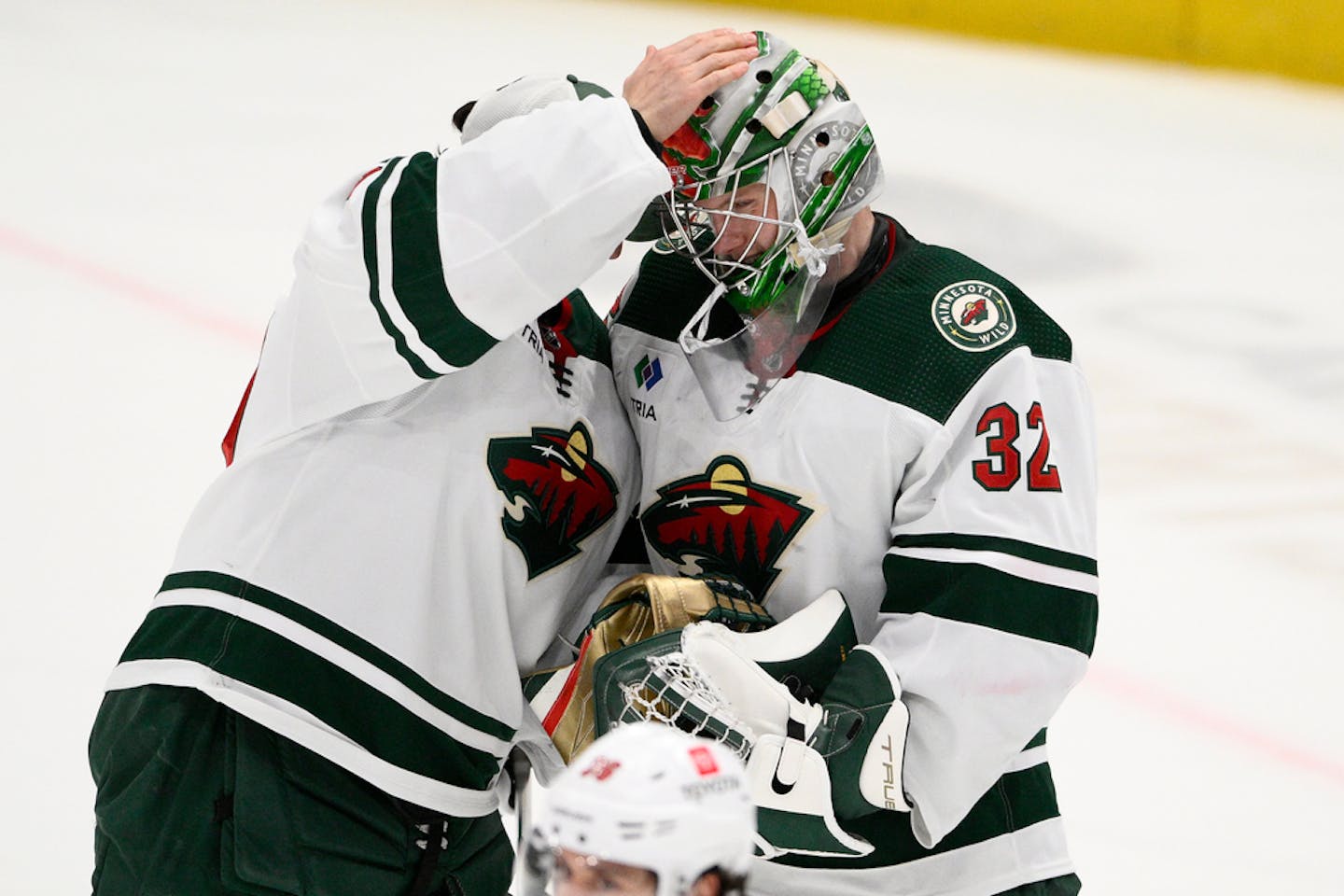 Minnesota Wild goaltender Filip Gustavsson (32) celebrates with teammate Marc-Andre Fleury, left, in a game last month.