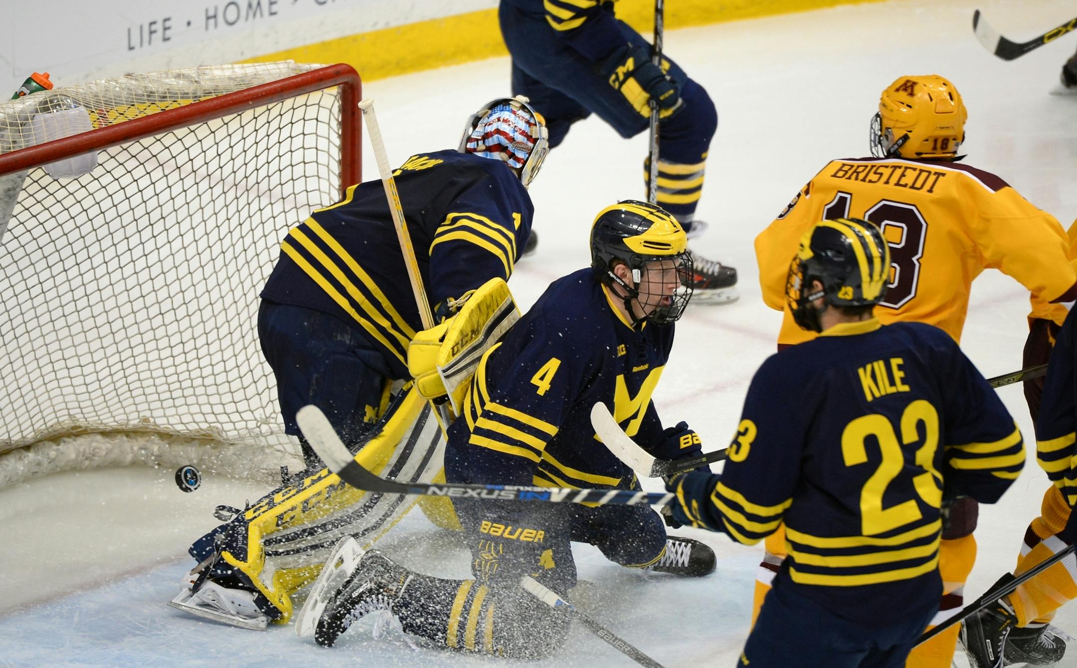 A shot by Minnesota Golden Gophers right wing Leon Bristedt (18) made it past Michigan Wolverines goalie Steve Racine (1) for a goal in the second period Saturday.
