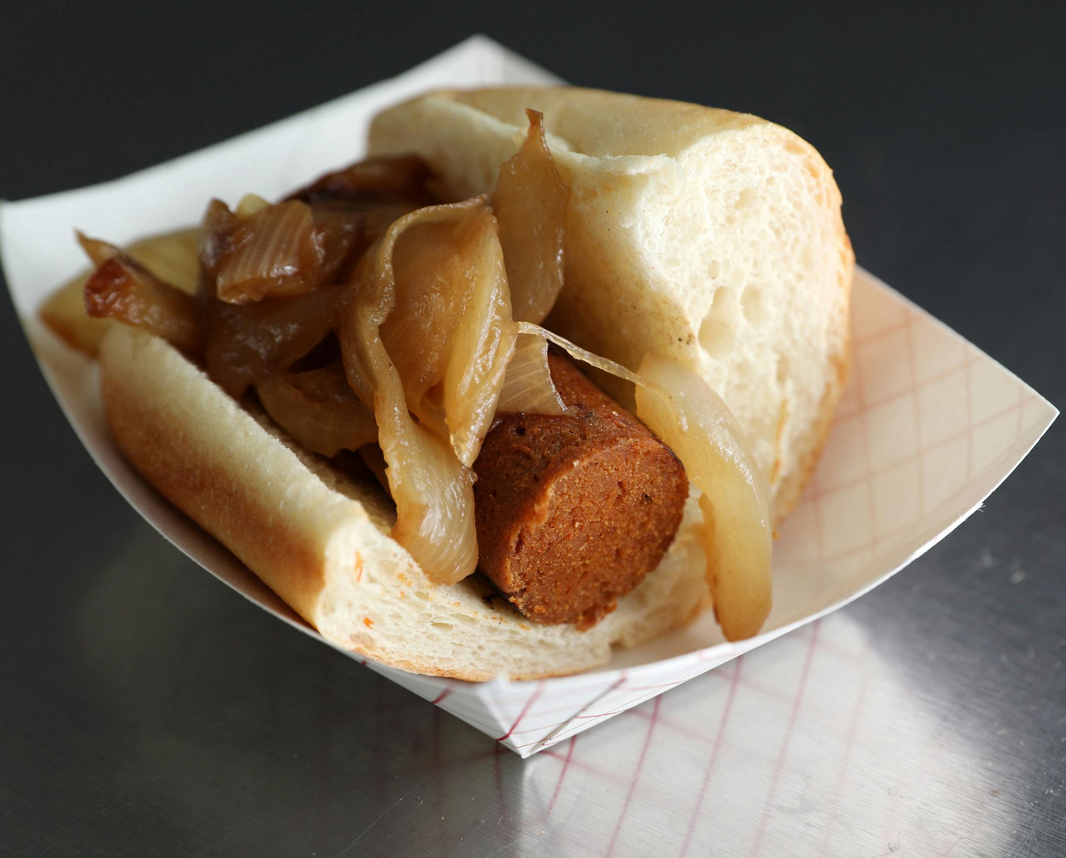 Pictured is the Herbivorous Butcher's vegan sriracha bratwurst with onions taken during a sneak preview of the new food concepts being unveiled at Target Field. ] ANTHONY SOUFFLE ï anthony.souffle@startribune.com Members of the media and select season ticket holders were given a sneak preview of the new food concepts being unveiled for this baseball season Thursday, March 30, 2017 at Target Field in Minneapolis.
