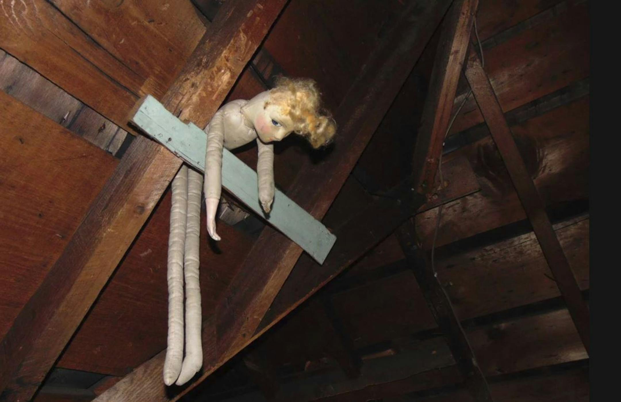Workers for Structure Tech Home Inspections found this creepy doll hanging in an attic.