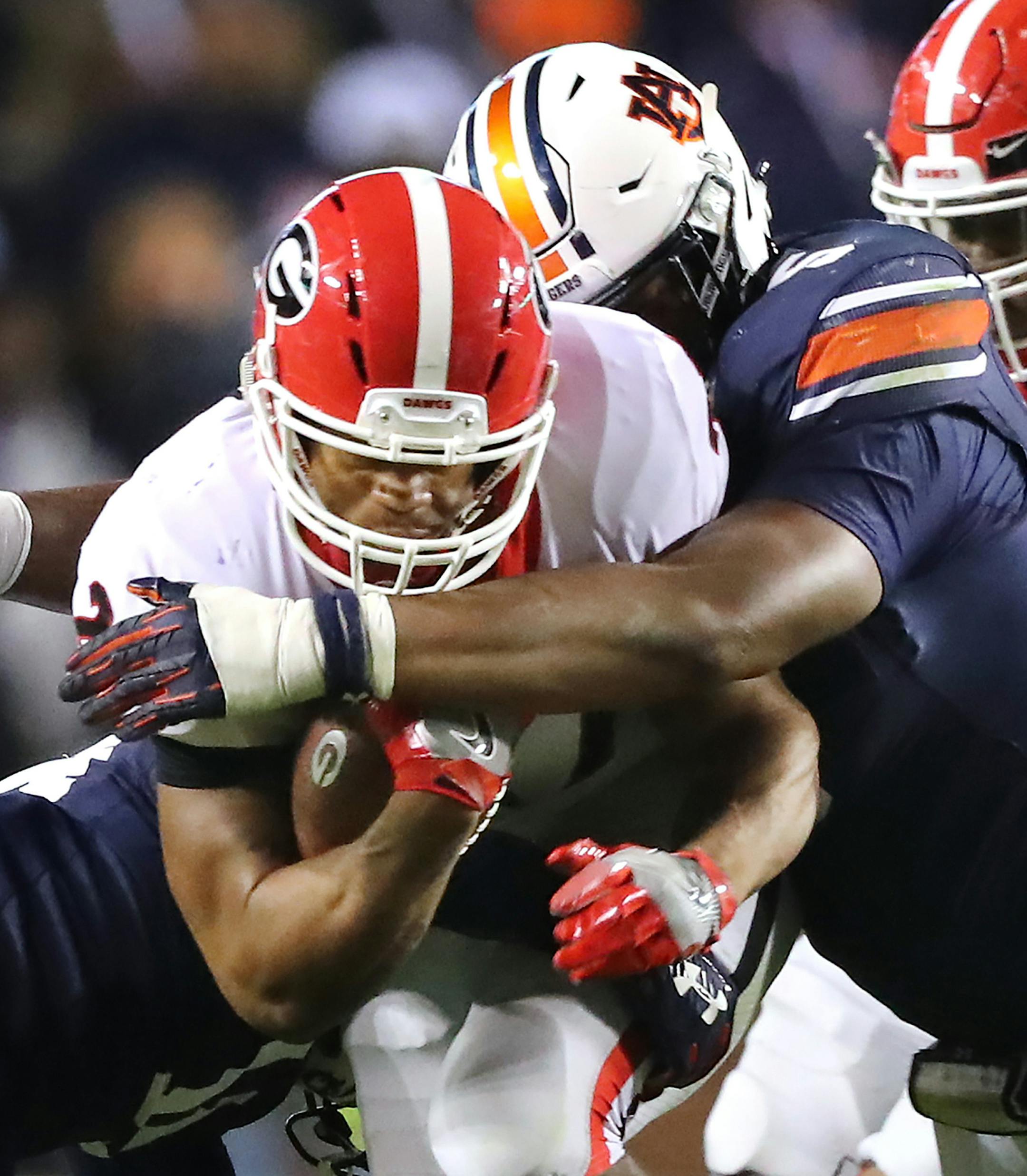 Auburn defender Derrick Brown tackles Georgia running back Nick Chubb during the second half on Saturday, Nov. 11, 2017 at Jordan-Hare Stadium, in Auburn, Ala. (Curtis Compton/Atlanta Journal-Constitution/TNS) ORG XMIT: 1215739