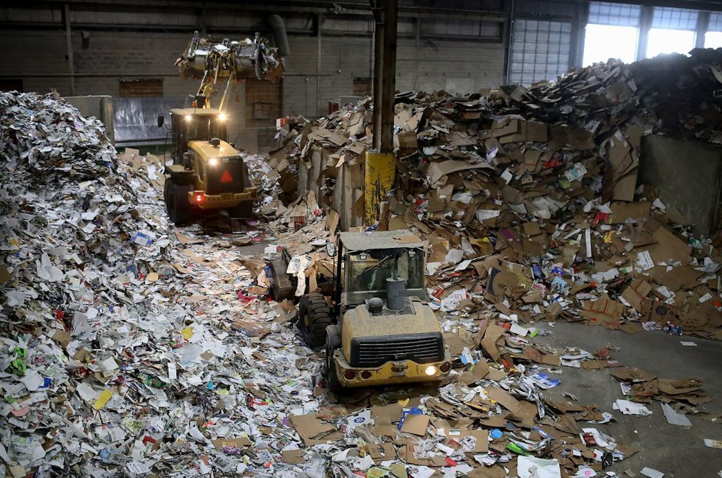 Employees sort recyclables at Eureka Recycling's sortation center in Minneapolis.