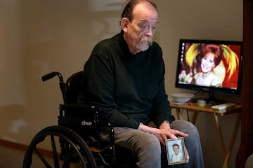 Robert Krause, held a photo of his mother, Jean Krause in 2017.