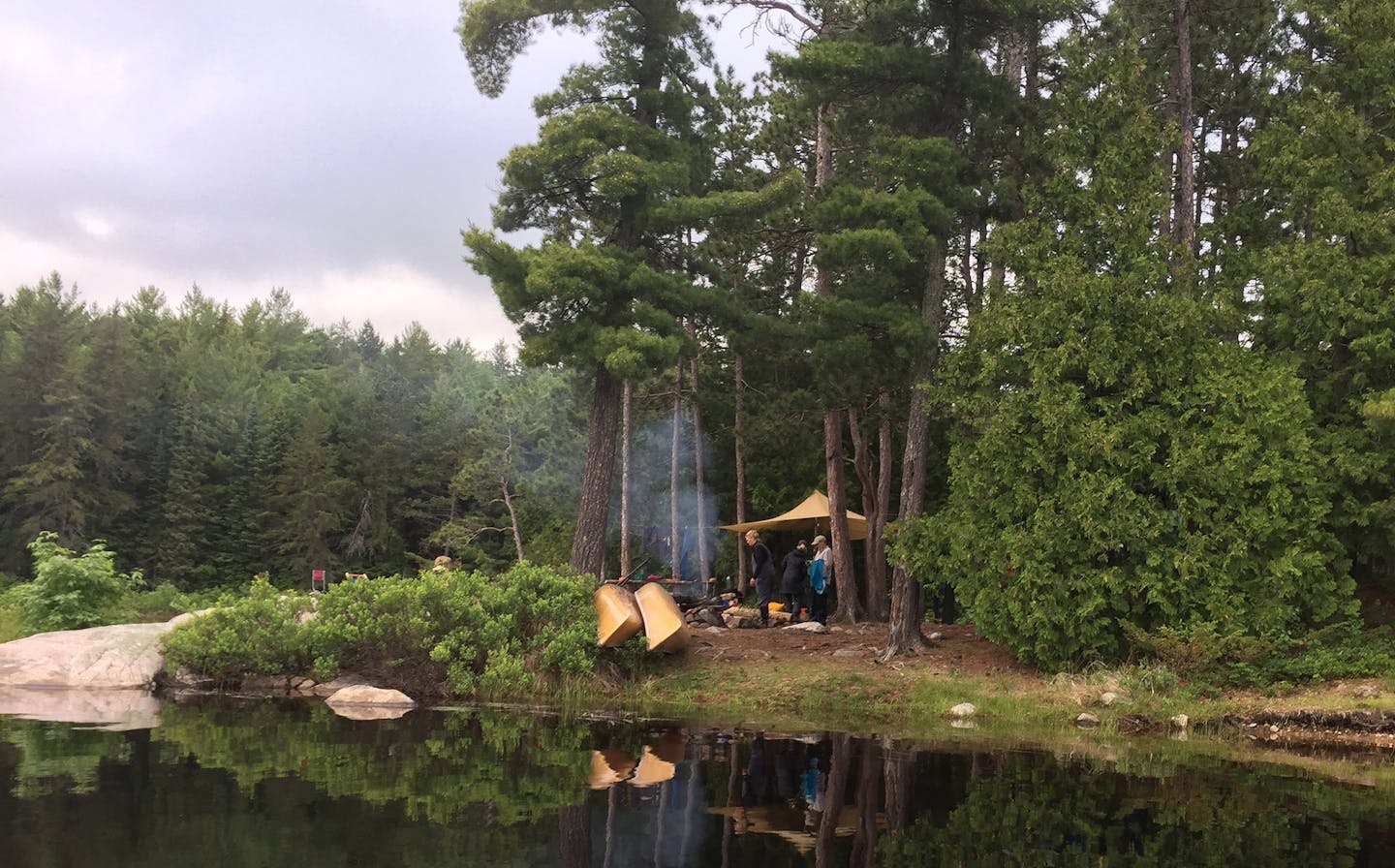 Six Twin Cities women traveling in Quetico Provincial Park camped on McAree Lake. From their campsite they took day trips to sightsee and fish. The adventure was a first into the wilderness for most of the women.