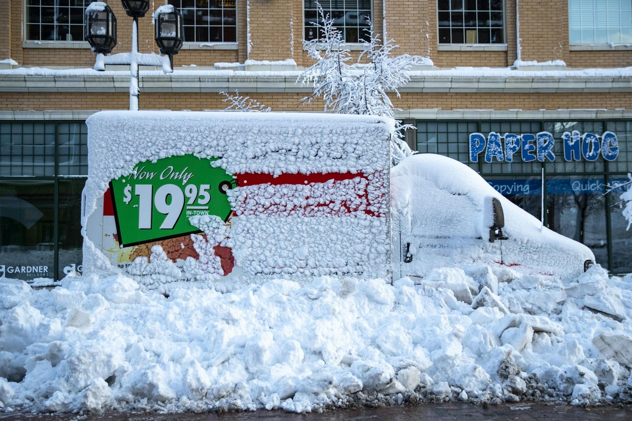 A U-Haul truck was completely snowed in by plows on First St. in downtown Duluth, MN on Sunday afternoon.