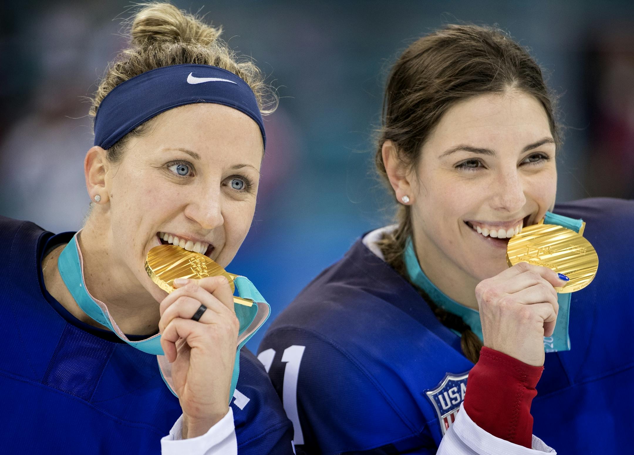 Meghan Duggan (10) and Hilary Knight (21) posed for photos with gold medal.