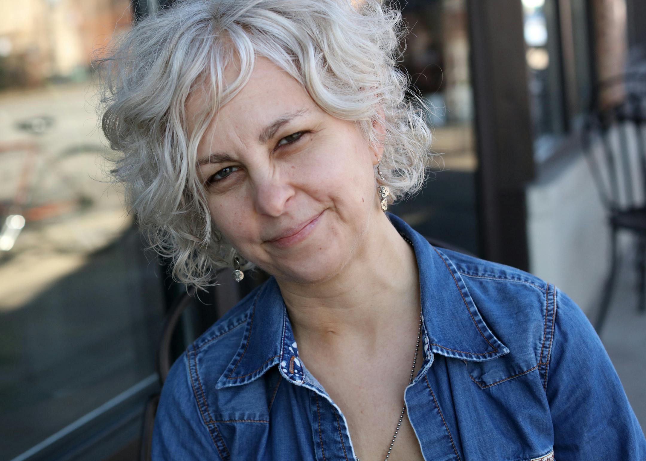 An interview with Kate DiCamillo about her new book, "Raymie Nightingale," a middle-grade novel about a florida girl who enters a pageant hoping to win her father back. DiCamillo has said that this book is closer to her heart than any other book--her own father left the family. [ Star Tribune photo by TOM WALLACE ï tom.wallace@startribune.com