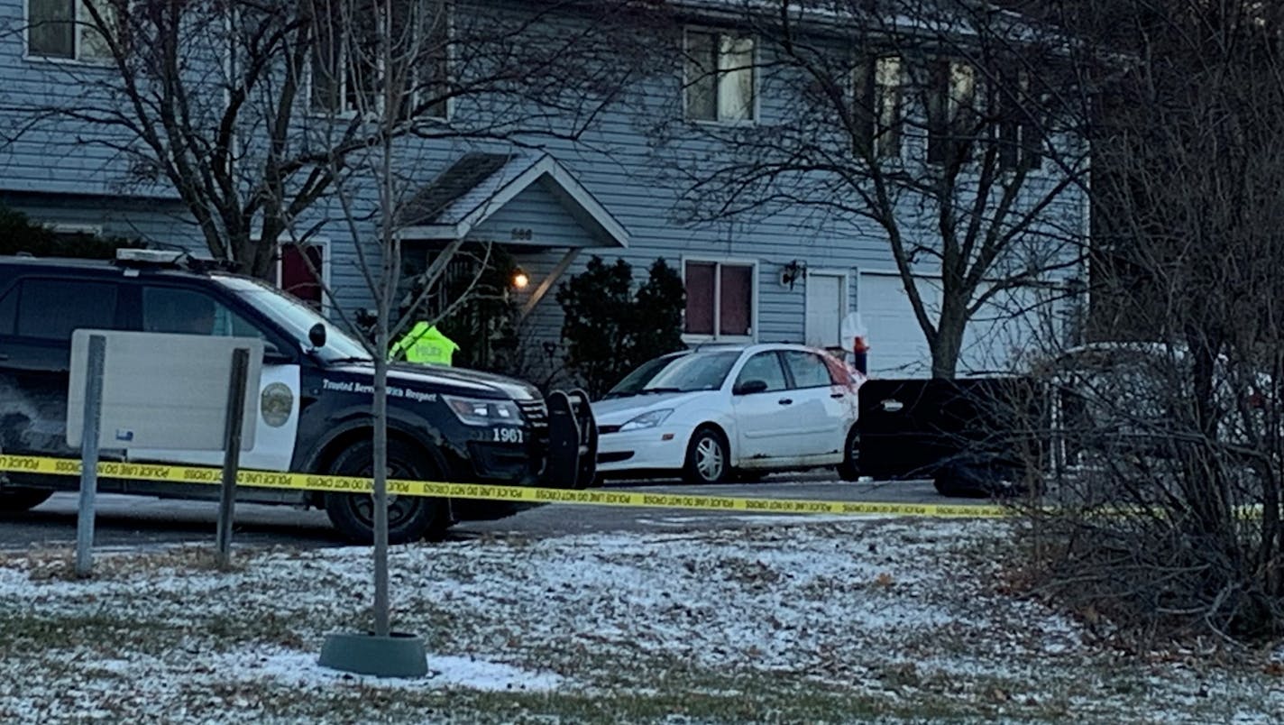 Crime scene investigators took photos of the scene where someone was fatally shot in the 500 block of Jessamine Ave. W. What appears to be blood was smeared on the side of the car.