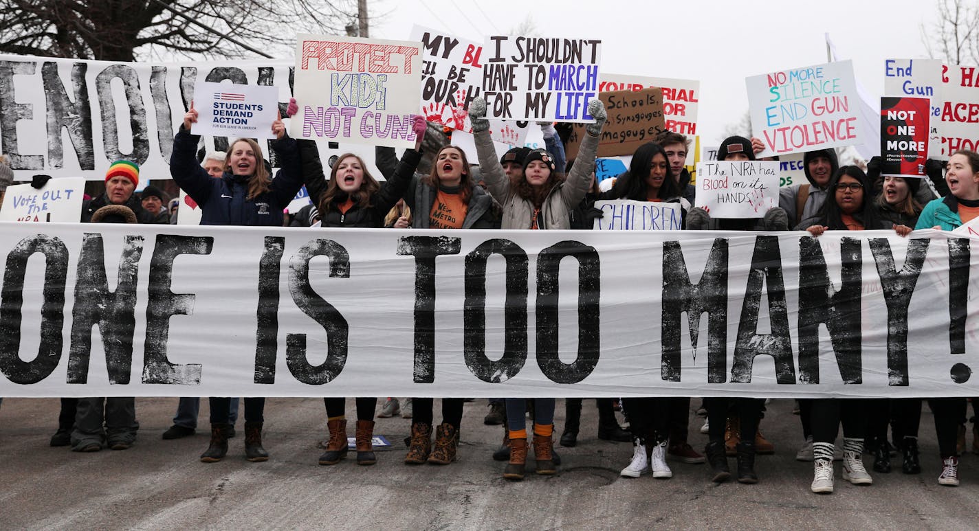 Students held signs as they gathered at Harriet Island Regional Park in St. Paul before matching to the State Capitol protesting gun violence Saturday. ] ANTHONY SOUFFLE &#xef; anthony.souffle@startribune.com Thousands of Minnesota students and other supporters of gun control marched Saturday, March 24, 2018 from Harriet Island in St. Paul to the State Capitol for a rally. The event is part of student-led movement dubbed March for Our Lives. The Minnesota March was but one of many "sibling march