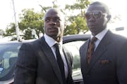 Minnesota Vikings running back Adrian Peterson, left, arrives for court in Conroe, Texas Wednesday, Oct. 8, 2014. Peterson arrived to face a charge of