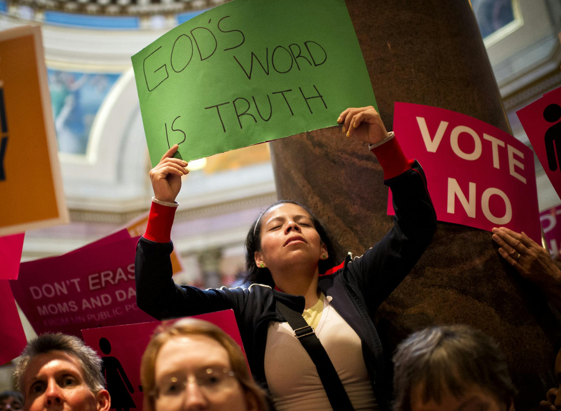 Crowds on both sides of the gay marriage debate gathered in the Capitol hours before the vote, displaying signs as they chanted, sang and prayed. Afterward, gay marriage supporters erupted into cheers of “Thank you” in the rotunda.