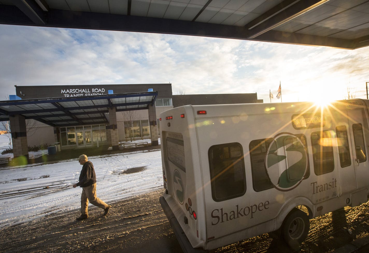 A bus driver walked from one bus to another to notify the other driver he had no transfers at the Shakopee Marschall Road Transit Station on Wednesday, January 21, 2015 in Shakopee, Minn. ] RENEE JONES SCHNEIDER &#x2022; reneejones@startribune.com
