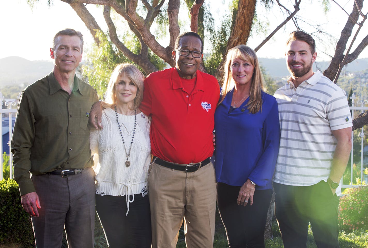 In this March 2, 2017, photo provided by the American Heart Association, posing from left are Ralf Reuland, Rhonda Carew, Rod Carew, Mary Reuland and the Reulands' son Austin at the Reuland home in San Juan Capistrano, Calif. Konrad Reuland, brother of Austin, was a former NFL football player who died of a brain aneurism at the age of 29 in December 2016. Reuland's heart and a kidney were anonymously transplanted into Rod Carew. Mutual friends connected Reuland's death with news of Carew's trans