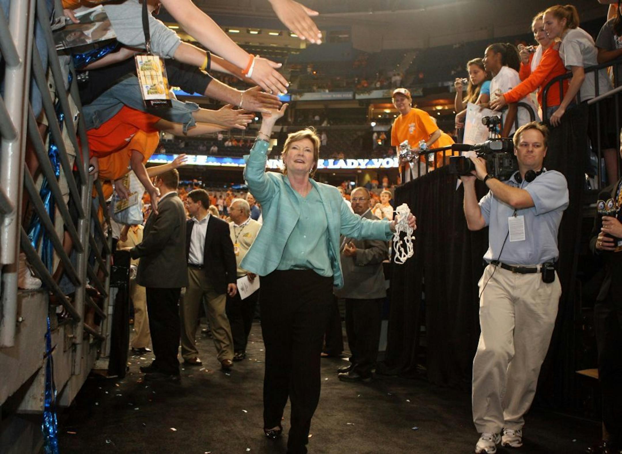 Tennessee coach Pat Summitt celebrates with Volunteer fans following a 64-48 victory over Stanford in the NCAA Women's Basketball Championship game at the St. Pete Times Forum on April 8, 2008 in Tampa, Fla. Summitt, who achieved the most wins in NCAA basketball history of any coach, died on June 28, 2016. She was 64.