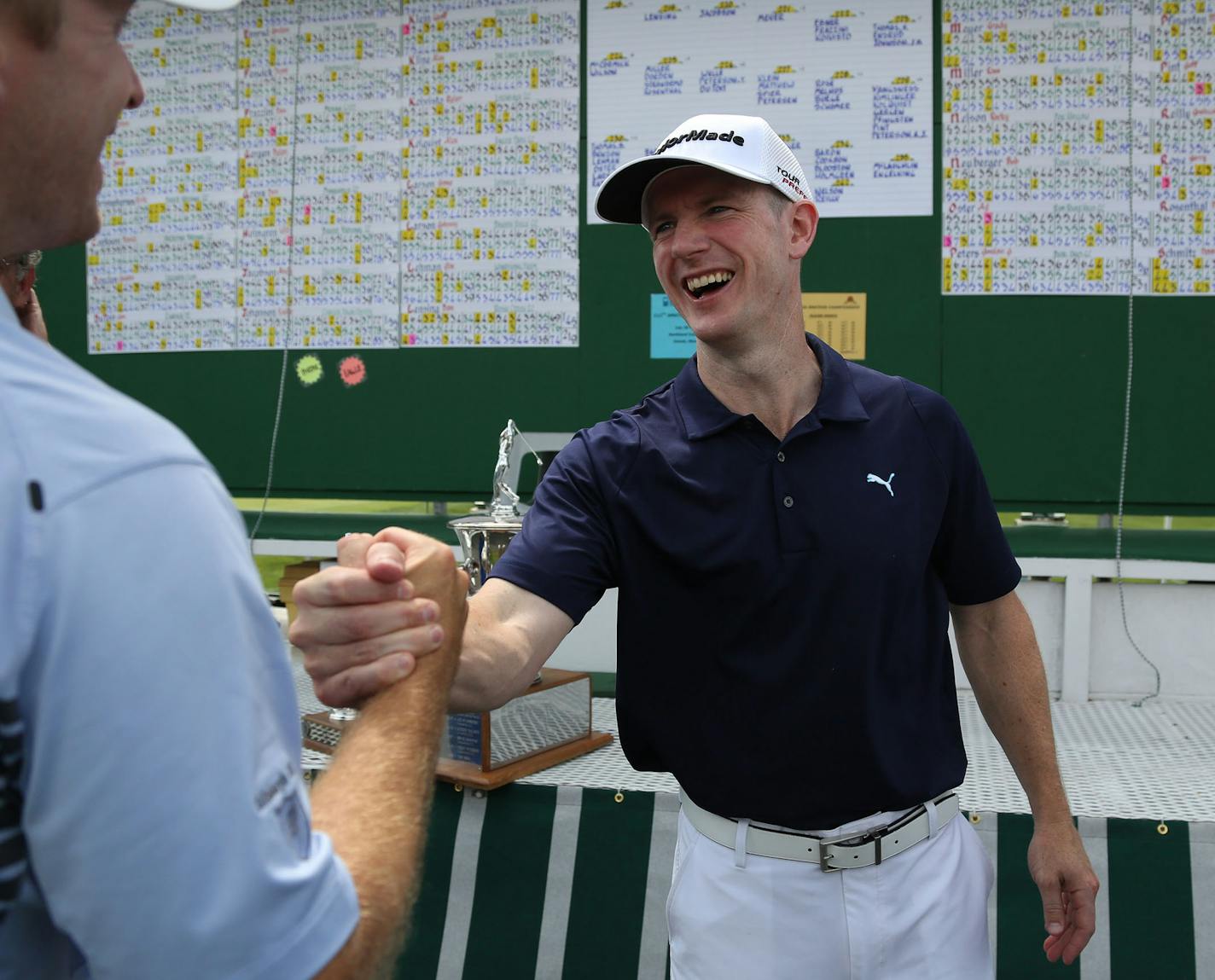 Winner Jesse Bull got congratulated by fellow golfers after the trophy ceremony. ] (KYNDELL HARKNESS/STAR TRIBUNE) kyndell.harkness@startribune.com The Minnesota State Amateur Golf Tournament at Golden Valley Country Club in Golden Valley, Min. Wednesday, July 23, 2014.