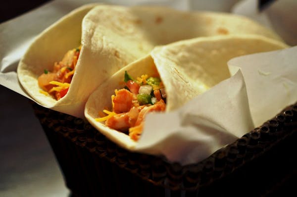 Lasting memories are created by spending time together at the table, eating favorite foods such as chicken tacos.