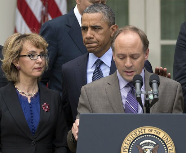 President Barack Obama blasts U.S. Senate for failing to pass measures to reduce gun violence. With him is former Rep. Gabby Giffords, left, and Mark 