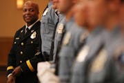 Acting police chief Medaria Arradondo stood with a group of recent police academy graduates as they took their class photo following a graduation cere