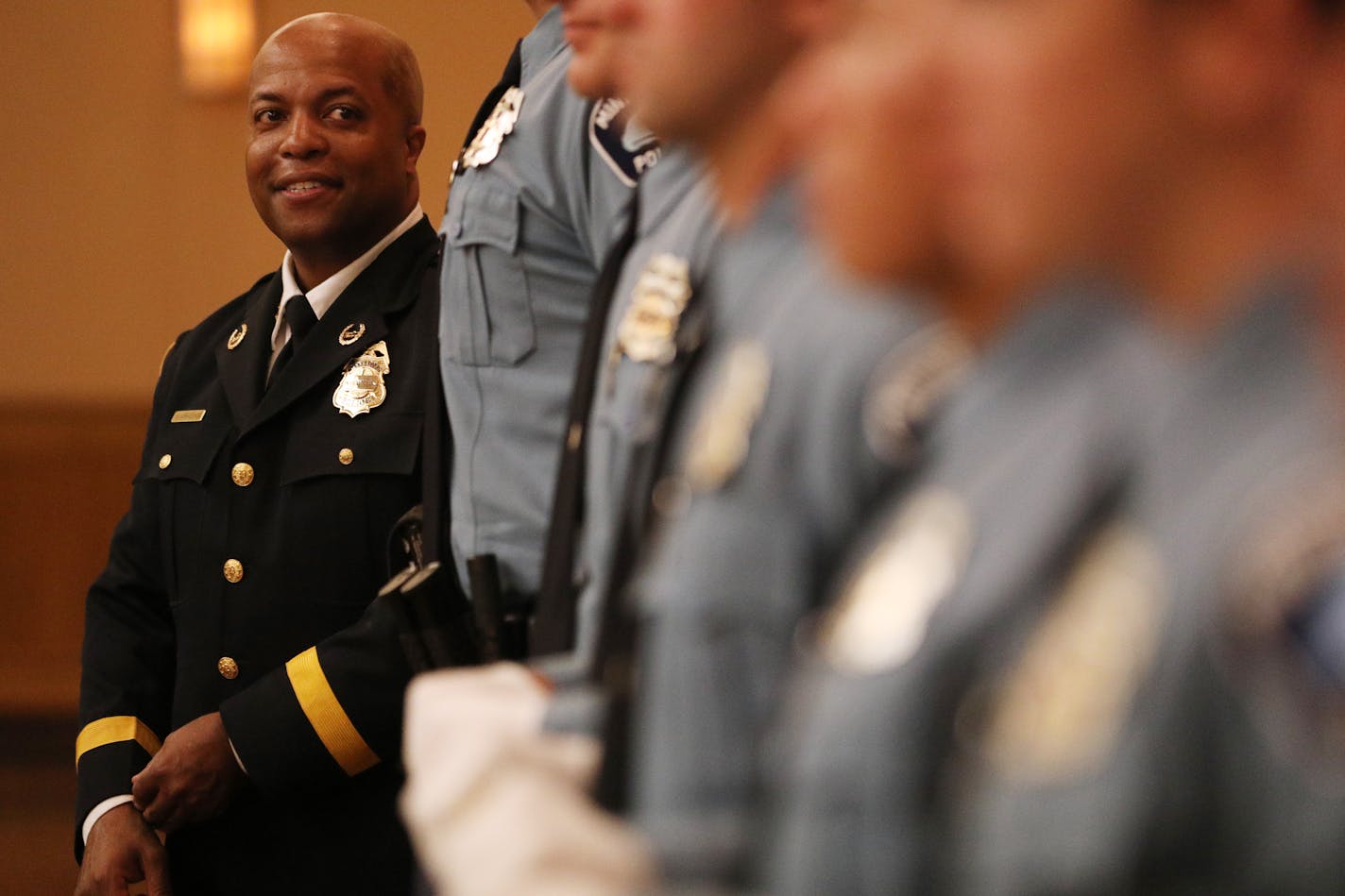 Acting police chief Medaria Arradondo stood with a group of recent police academy graduates as they took their class photo following a graduation ceremony. ] ANTHONY SOUFFLE • anthony.souffle@startribune.com