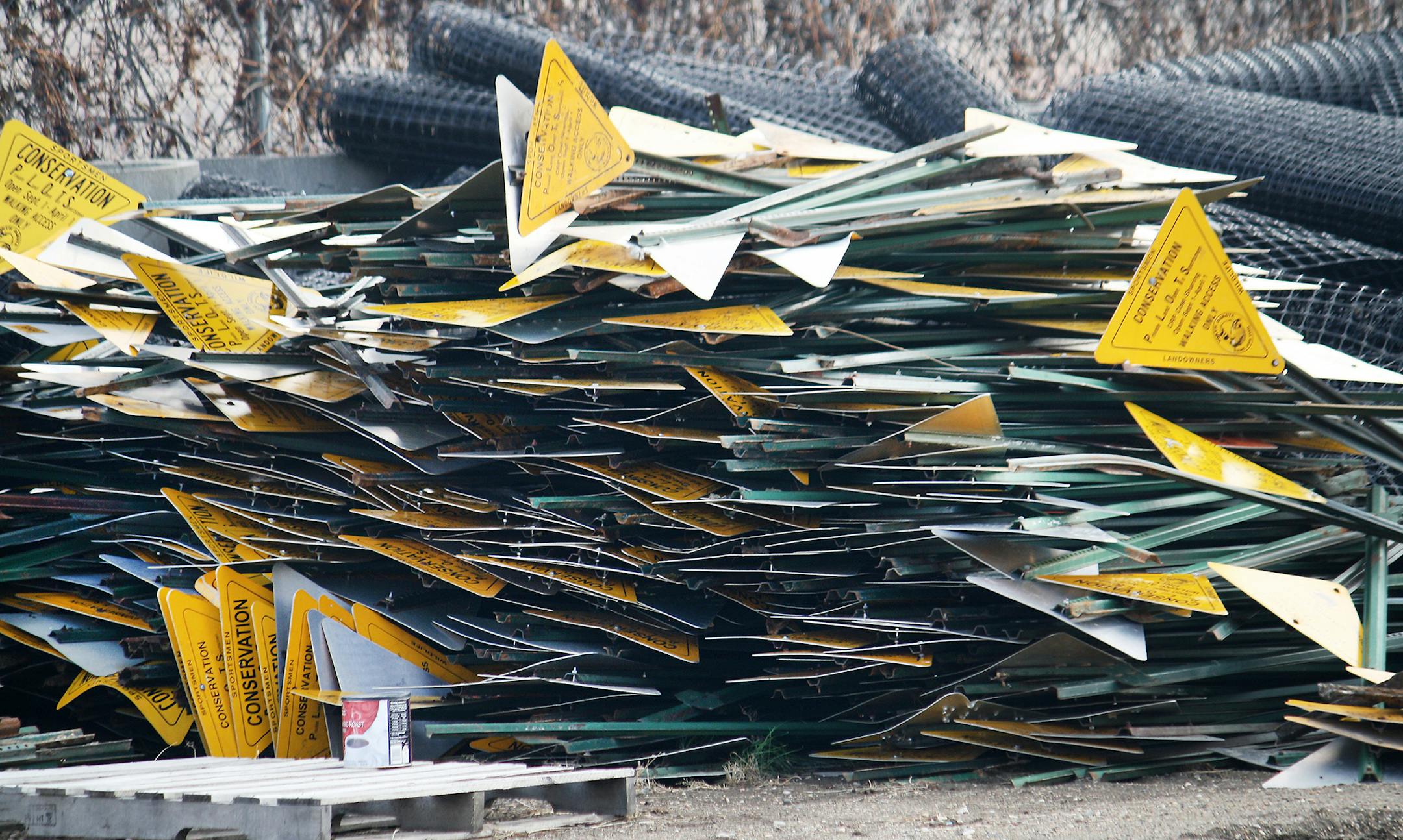 This stack of signs removed from lands enrolled in North Dakota's PLOTS (Private Land Open to Sportsmen) in 2012 underscore the loss of about 250,000 acres in the program over the past two years. Photo by Renae Heinle/N.D. Game and Fish Department