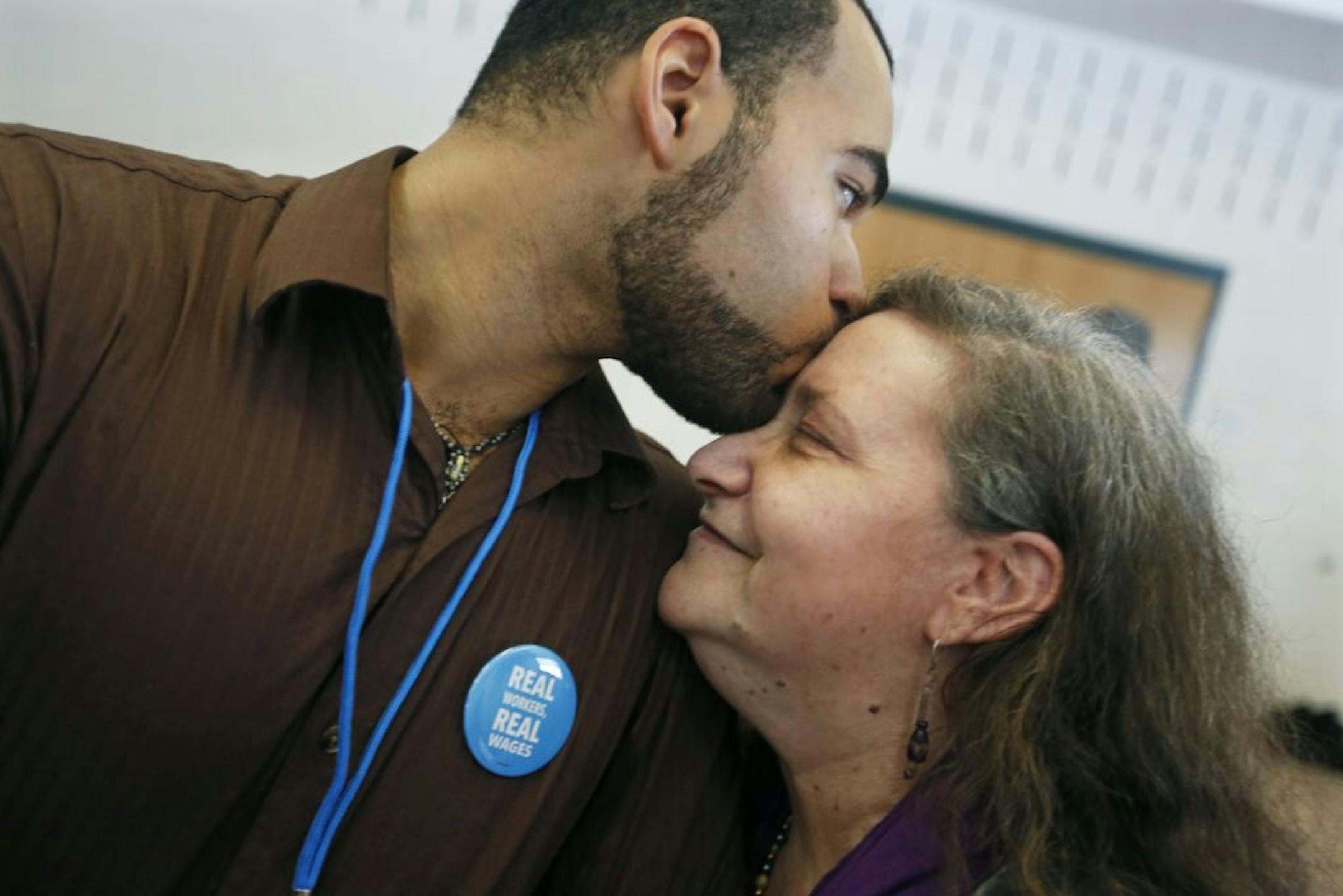 Lynn Rubenstein Nicholson, who has degenerative spinal disease, got a kiss from her son, Zev Nicholson, a personal assistant who cares for her.