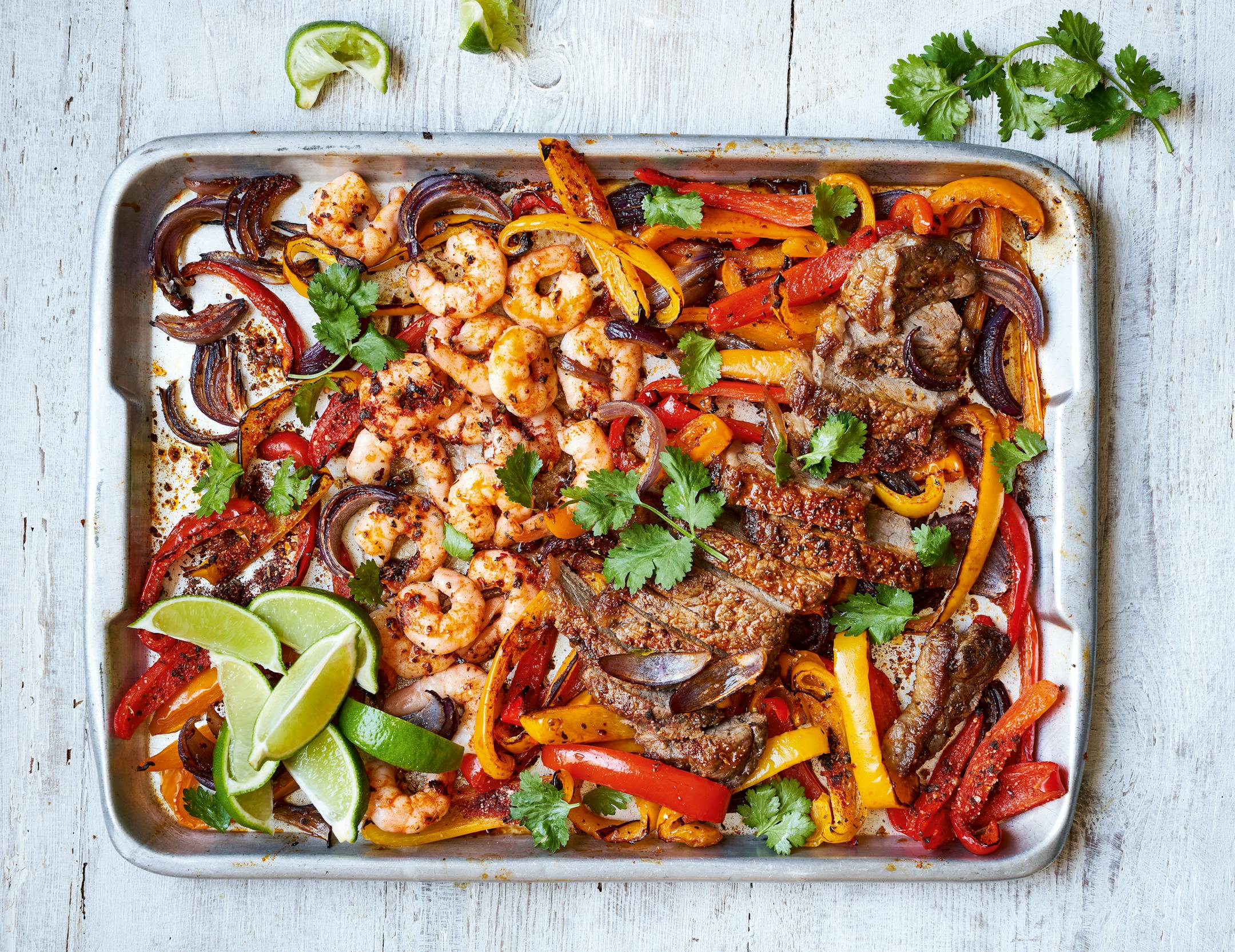 Surf 'n Turf Traybake is a quick meal that feels special. From "The Slimming Foodie in Minutes," by Pip Payne (Aster, 2023) Credit: Chris Terry