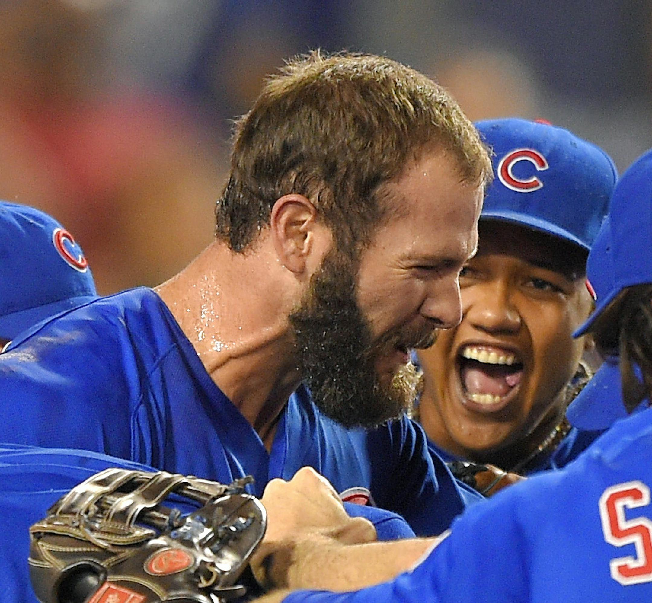 Chicago Cubs starting pitcher Jake Arrieta, with beard, celebrates with teammates after completing a no-hitter in a baseball game against the Los Angeles Dodgers, Sunday, Aug. 30, 2015, in Los Angeles. The Cubs won 2-0. (AP Photo/Mark J. Terrill) ORG XMIT: MIN2015083119133653