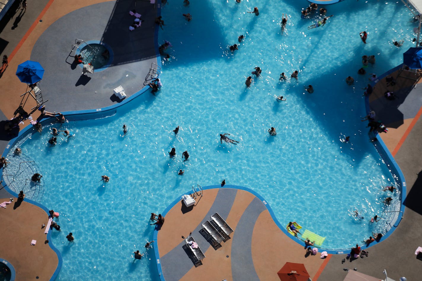 People swim on the Fourth of July in a pool at the Strat hotel-casino Saturday, July 4, 2020, in Las Vegas. (AP Photo/John Locher)