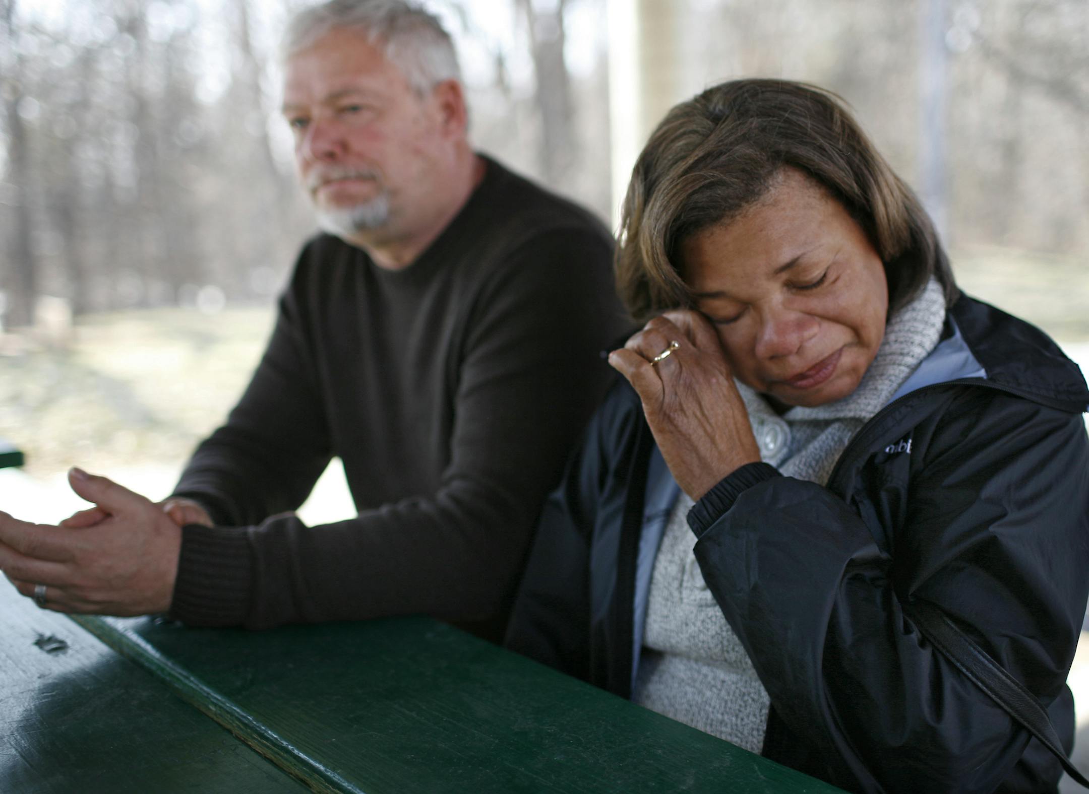 Shirley Bak, right, wipes a tear as she speaks about her son, Travis Benjamin, who went missing after his Hummer went into the Mississippi River early Friday morning in Ramsey. At left is Clemons Bak, Benjamin’s stepfather.