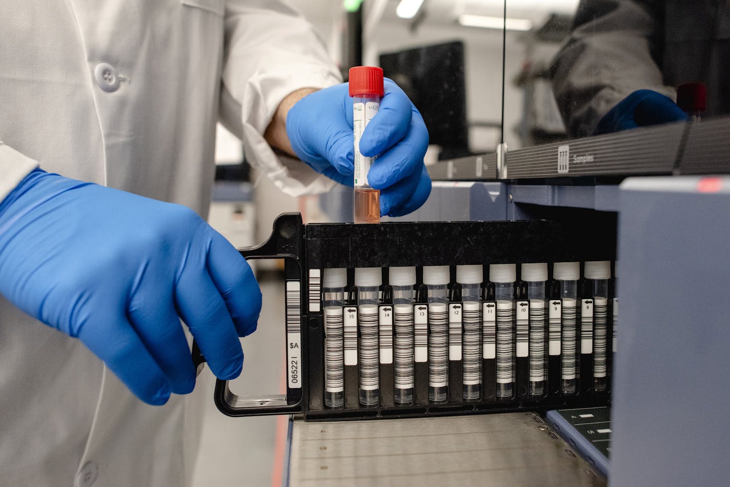 Dr. Dwayne Breining, executive director of the Northwell Health Laboratories, demonstrates a coronavirus test processing procedure in Lake Success, N.Y., on Wednesday, March 4, 2020.