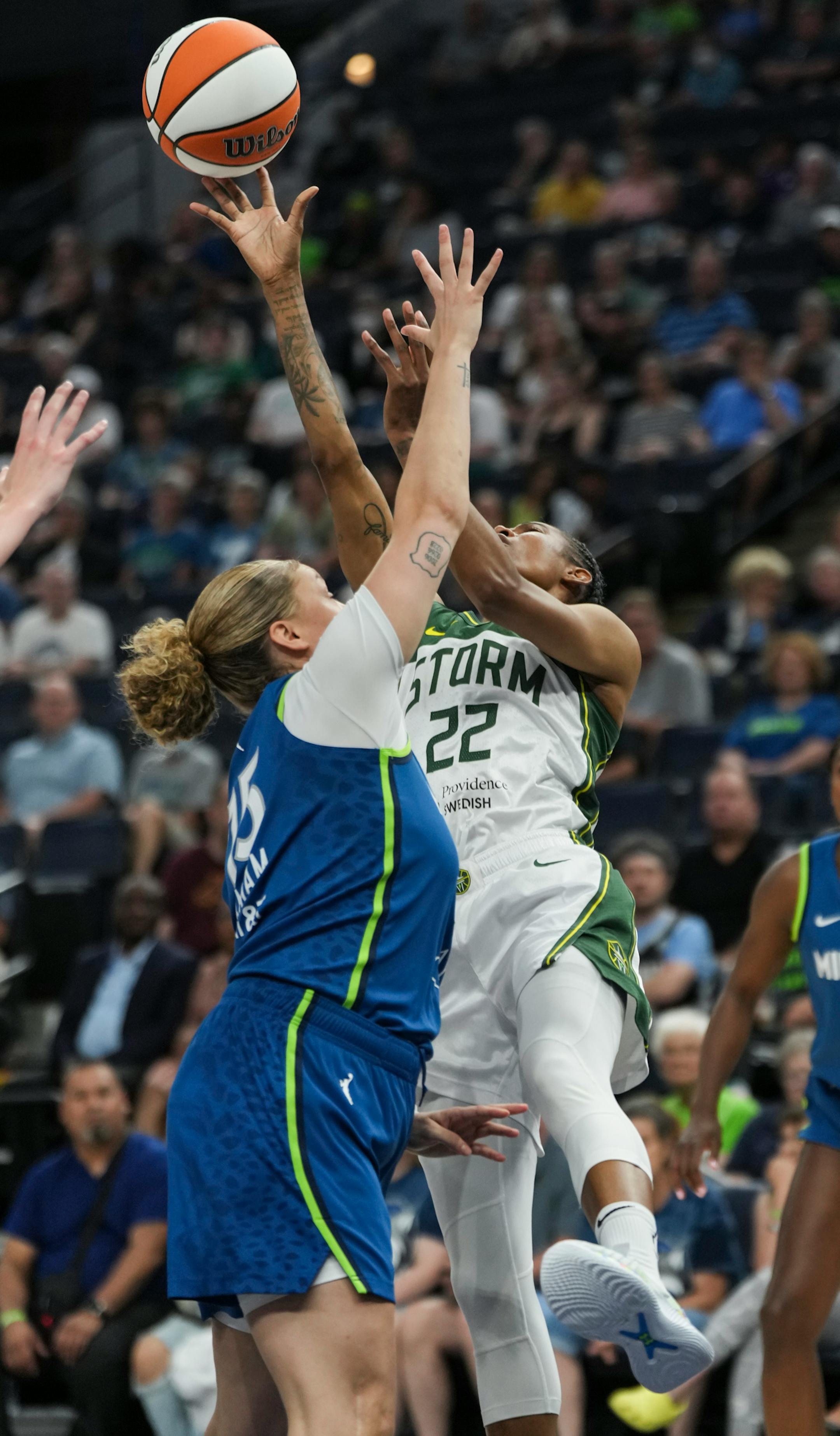Minnesota Lynx guard Rachel Banham (15) fouls on Seattle Storm guard Yvonne Turner (22) in the first half. The Minnesota Lynx hosted the Seattle Storm on Tuesday, June 27, 2023 at the Target Center in Minneapolis.
